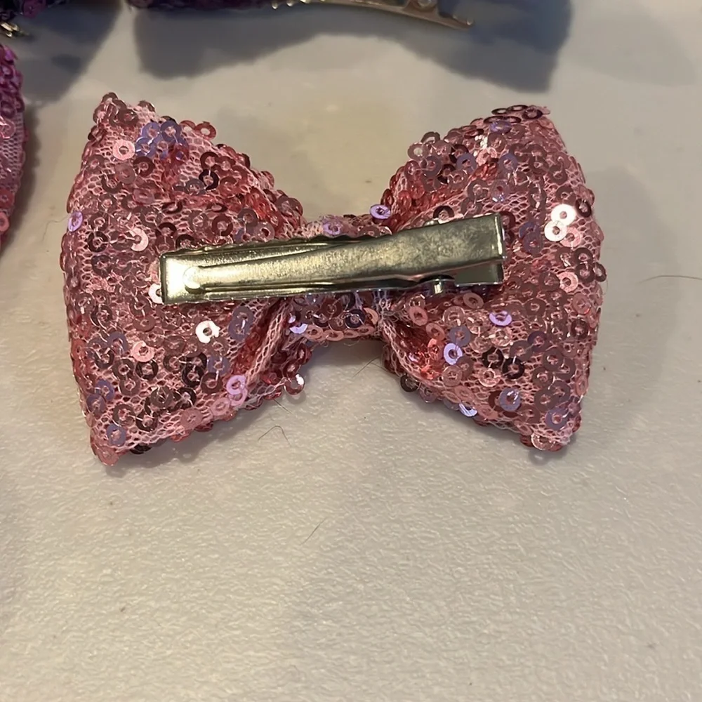 Set of 7.  Girls hair bows.  Alligator clips. 3 inches long.  Sparkly